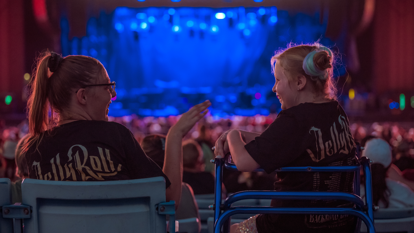 2 people sitting in our Accessibility seating. 