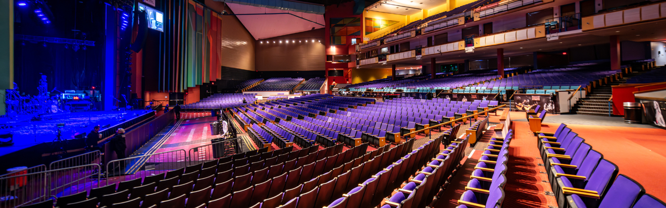Empy Oakdale Theatre with rows of purple chairs
