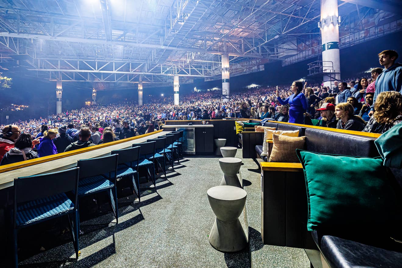 a photo of an empty Rock Box with a crowd in the background