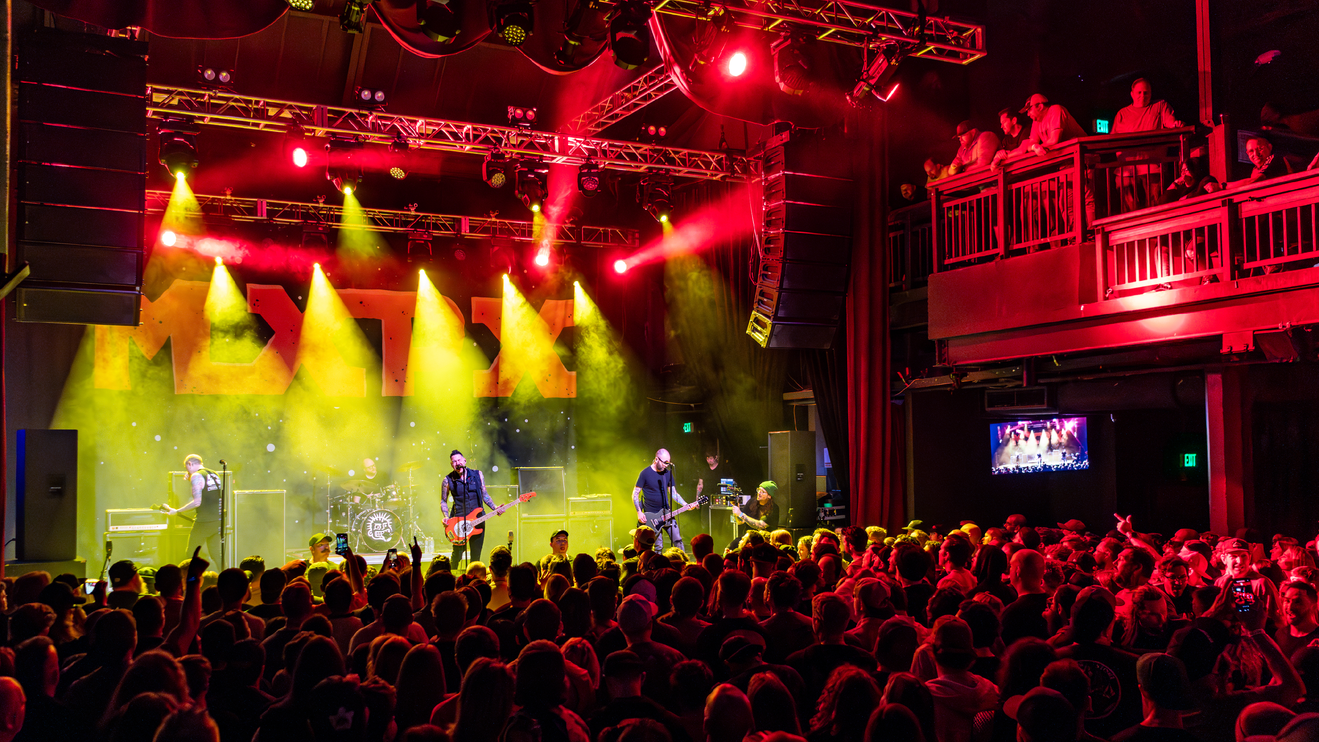 People watch a show at The Depot