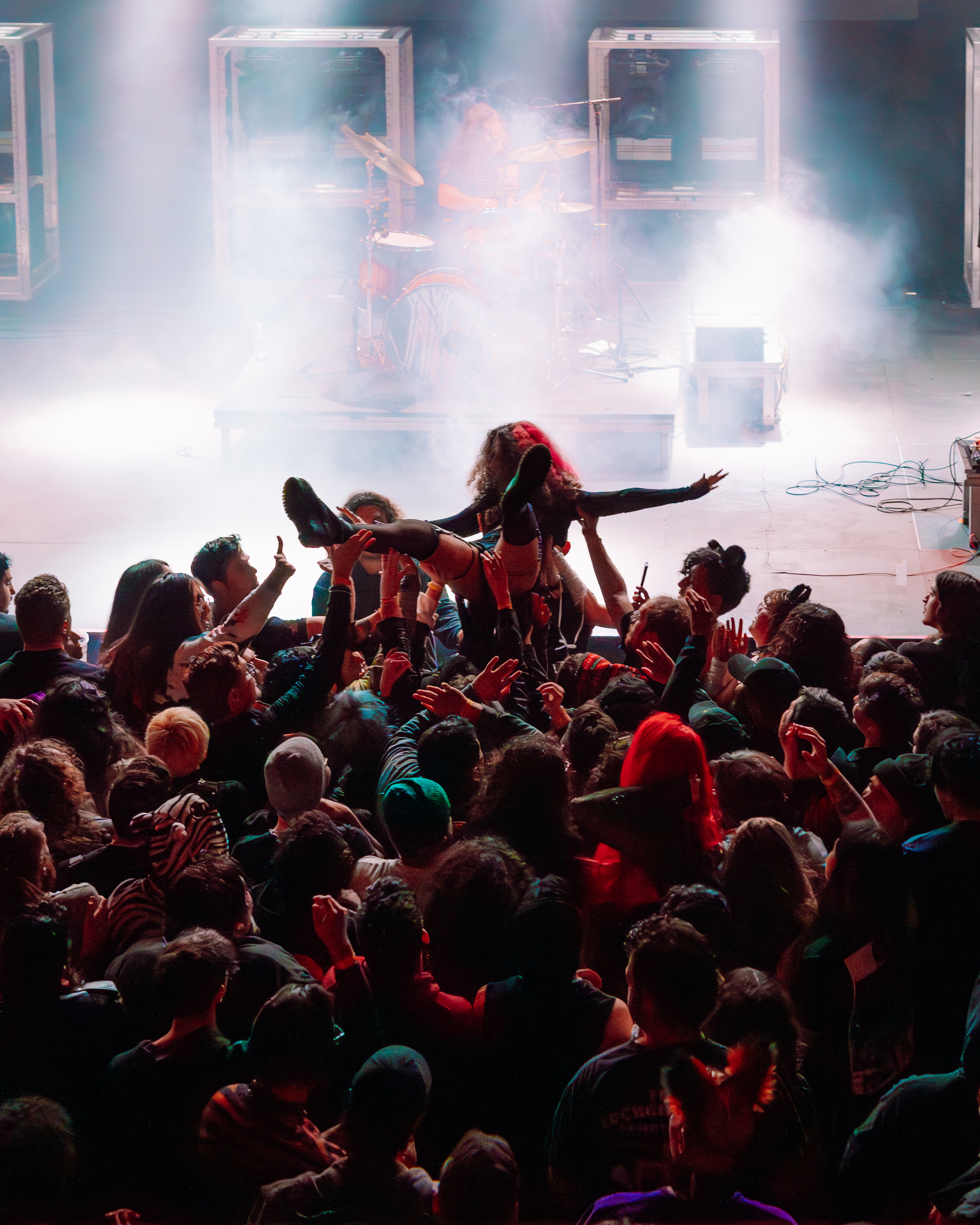 A fan crowdsurfs at The Belasco